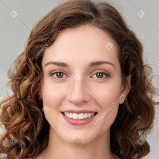 Joyful white young-adult female with long  brown hair and green eyes