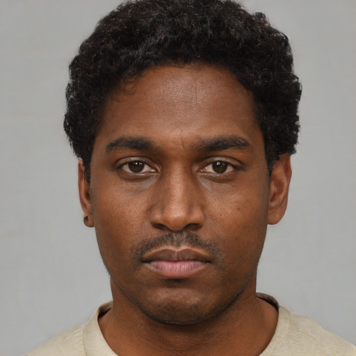 Neutral black young-adult male with short  black hair and brown eyes