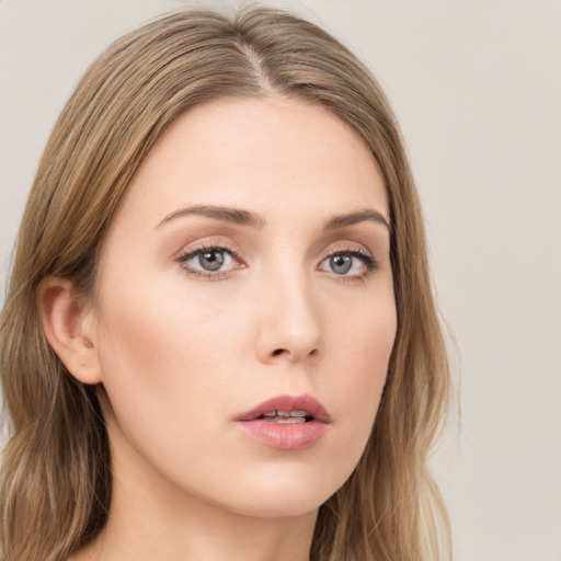 Neutral white young-adult female with long  brown hair and grey eyes