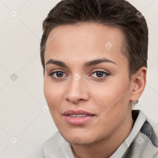 Joyful white young-adult female with short  brown hair and brown eyes