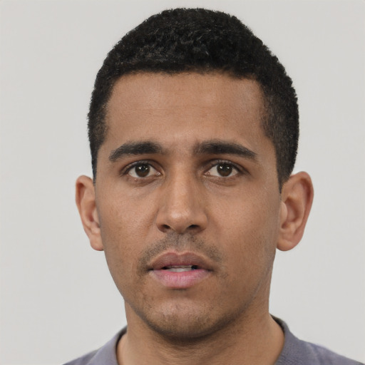Neutral black young-adult male with short  black hair and brown eyes