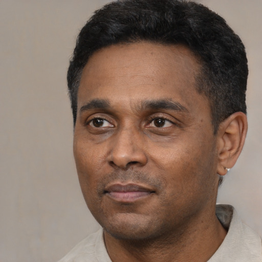 Neutral latino adult male with short  black hair and brown eyes