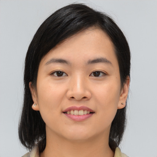Joyful asian young-adult female with medium  black hair and brown eyes