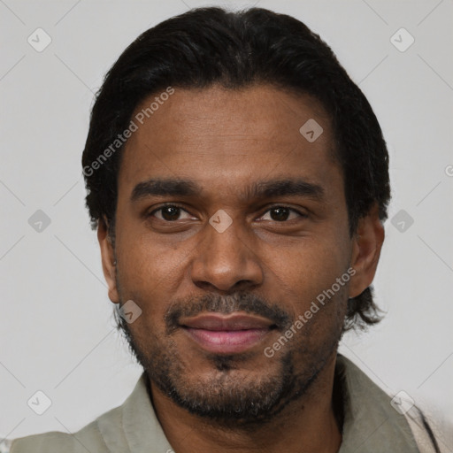 Joyful black young-adult male with short  black hair and brown eyes