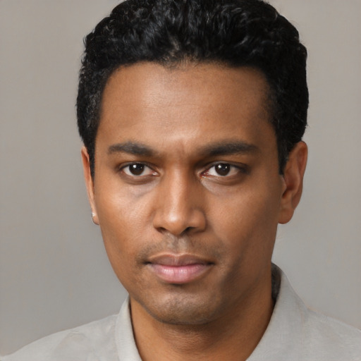 Neutral black young-adult male with short  black hair and brown eyes
