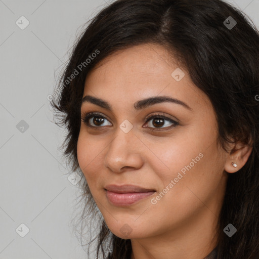 Joyful latino young-adult female with long  brown hair and brown eyes