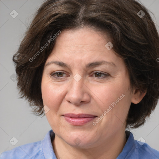 Joyful white adult female with medium  brown hair and brown eyes