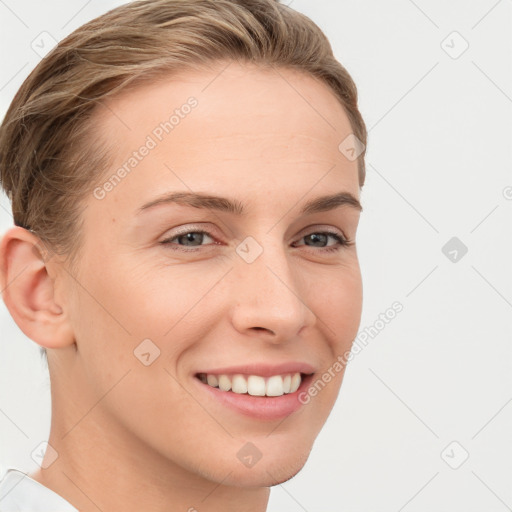 Joyful white young-adult female with short  brown hair and grey eyes