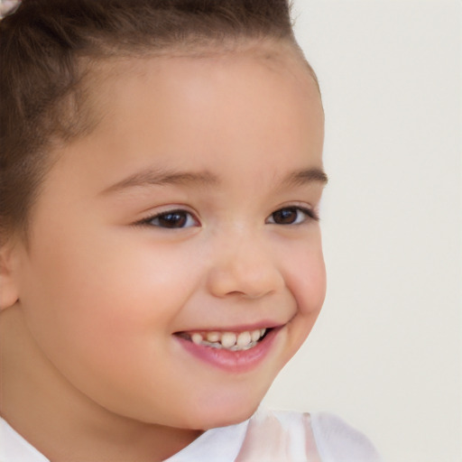 Joyful white child female with short  brown hair and brown eyes