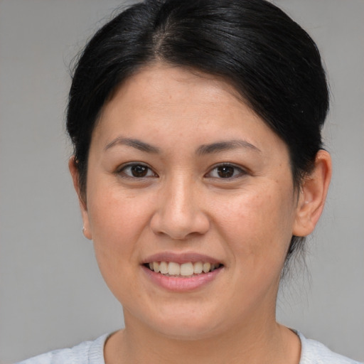 Joyful white young-adult female with medium  brown hair and brown eyes