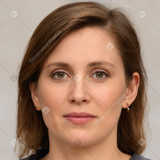 Joyful white young-adult female with medium  brown hair and green eyes