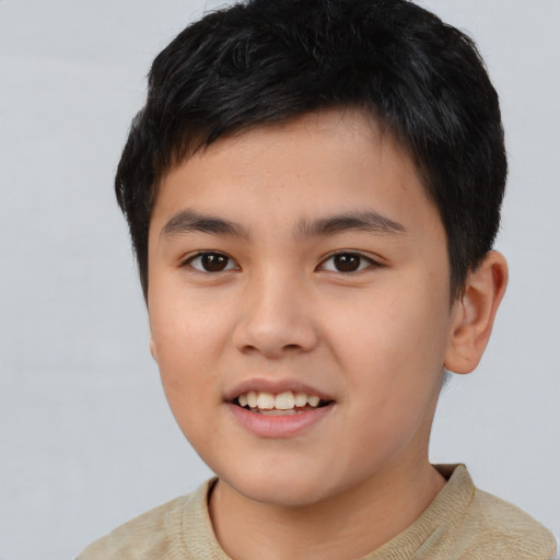 Joyful asian child male with short  brown hair and brown eyes