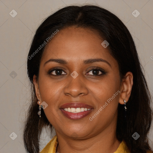 Joyful black young-adult female with long  brown hair and brown eyes