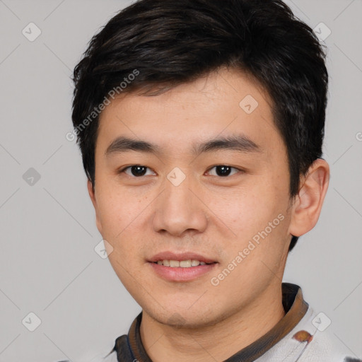 Joyful white young-adult male with short  black hair and brown eyes