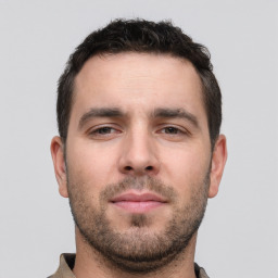 Neutral white young-adult male with short  brown hair and brown eyes