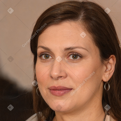 Joyful white adult female with medium  brown hair and brown eyes