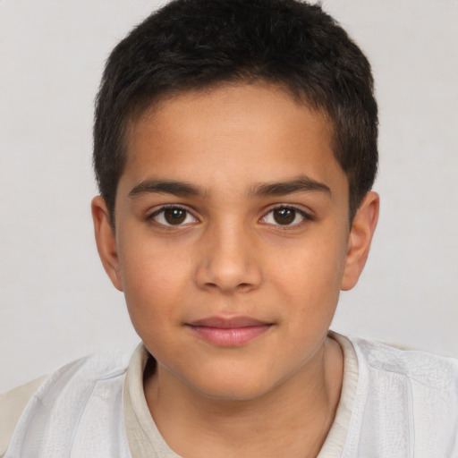 Joyful white child male with short  brown hair and brown eyes