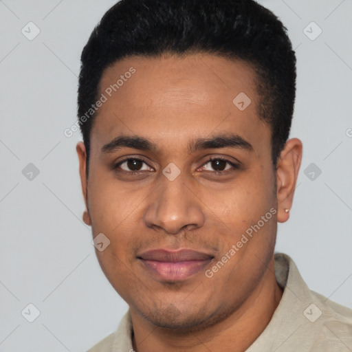 Joyful black young-adult male with short  black hair and brown eyes