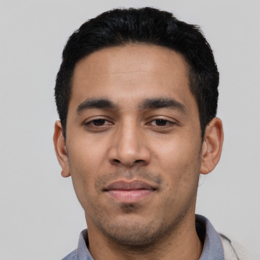 Neutral latino young-adult male with short  black hair and brown eyes