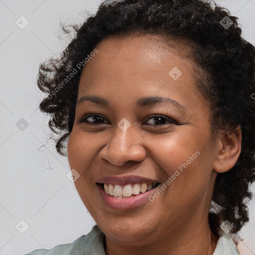 Joyful black young-adult female with medium  brown hair and brown eyes