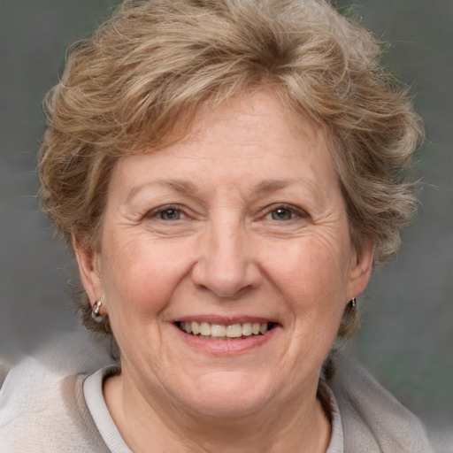 Joyful white middle-aged female with medium  brown hair and brown eyes