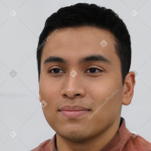 Joyful asian young-adult male with short  black hair and brown eyes