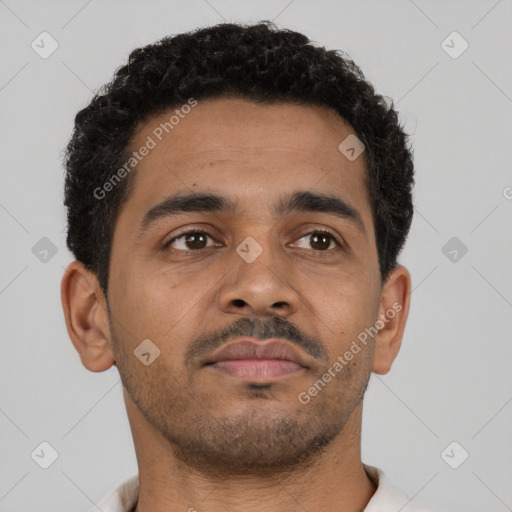 Neutral latino young-adult male with short  brown hair and brown eyes