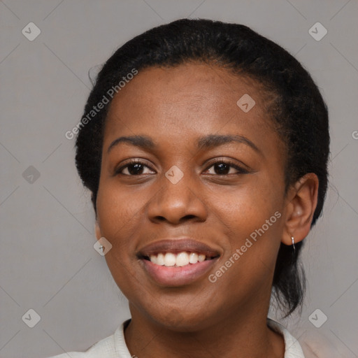 Joyful black young-adult female with medium  black hair and brown eyes