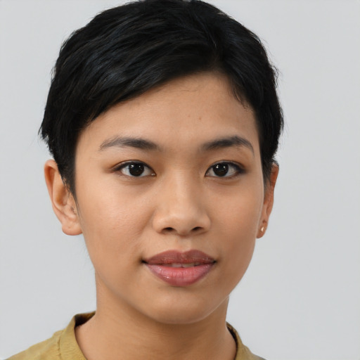 Joyful asian young-adult female with short  black hair and brown eyes