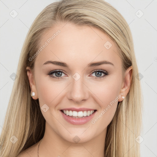 Joyful white young-adult female with long  brown hair and blue eyes