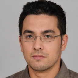 Neutral white young-adult male with short  black hair and brown eyes