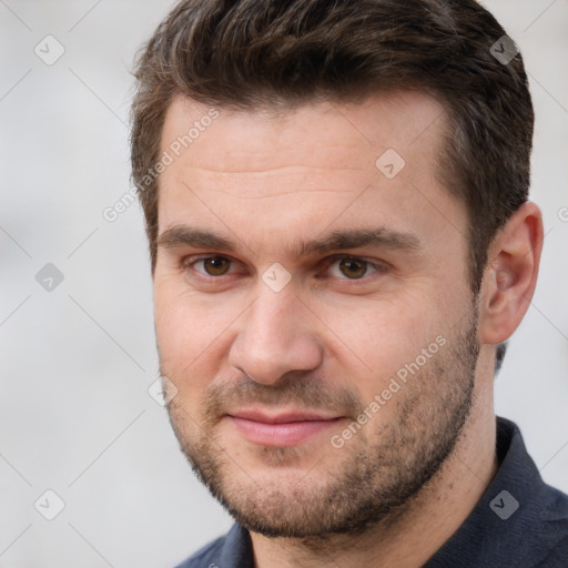 Joyful white young-adult male with short  brown hair and brown eyes