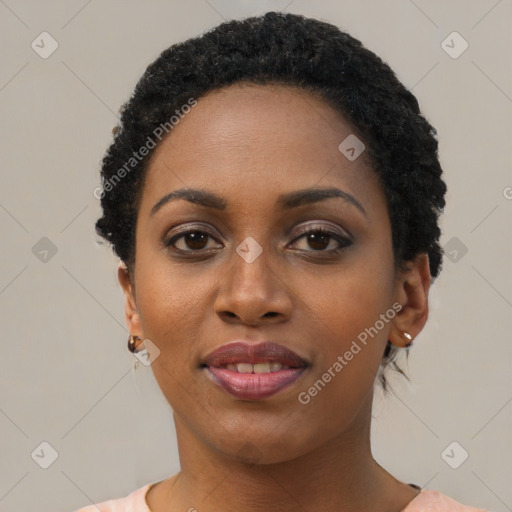 Joyful black young-adult female with short  black hair and brown eyes