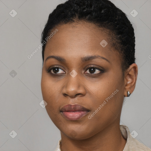 Joyful black young-adult female with short  brown hair and brown eyes