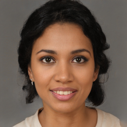 Joyful latino young-adult female with medium  black hair and brown eyes