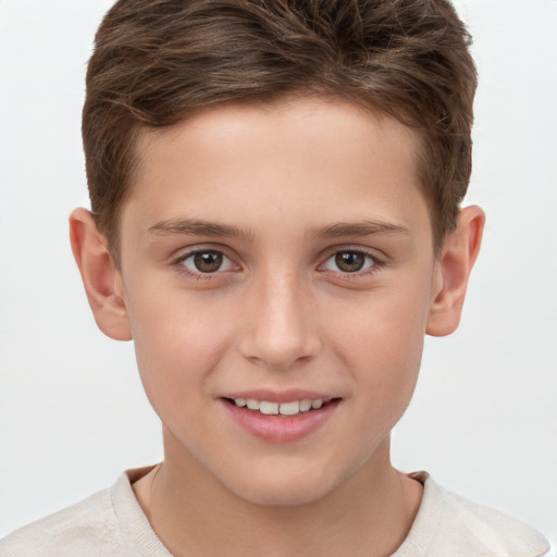 Joyful white child male with short  brown hair and brown eyes