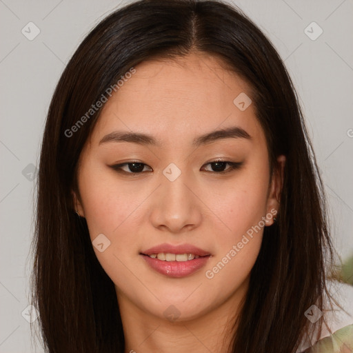 Joyful asian young-adult female with long  brown hair and brown eyes