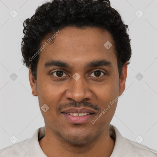 Joyful black young-adult male with short  black hair and brown eyes