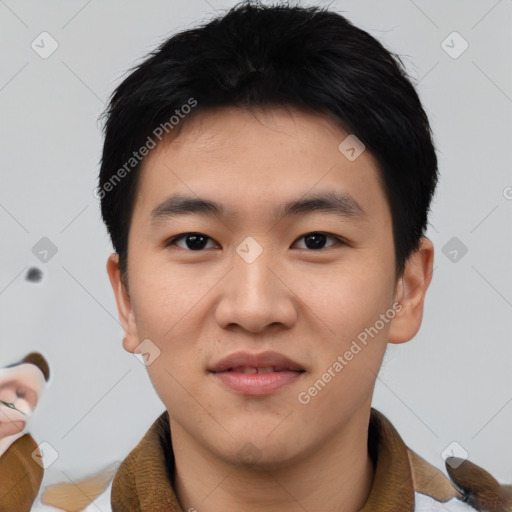 Joyful asian young-adult male with short  black hair and brown eyes