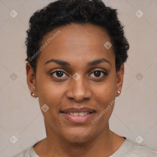 Joyful black young-adult female with short  black hair and brown eyes