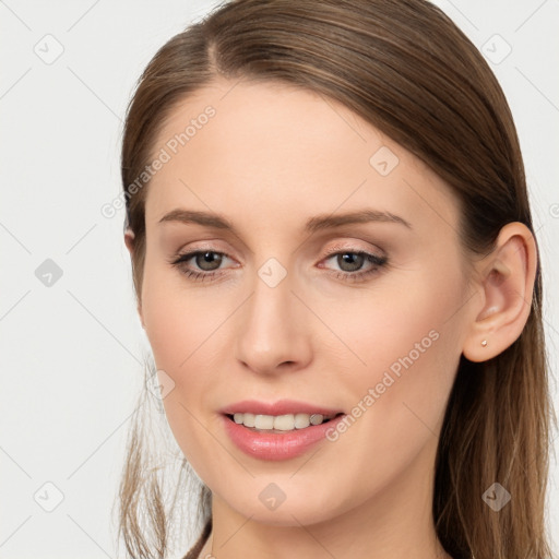 Joyful white young-adult female with long  brown hair and grey eyes