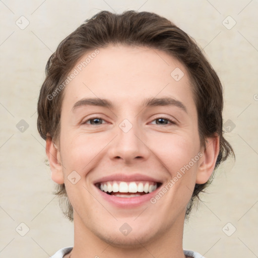 Joyful white young-adult male with medium  brown hair and brown eyes