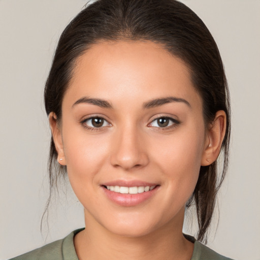 Joyful white young-adult female with medium  brown hair and brown eyes