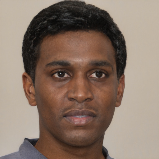 Neutral black young-adult male with short  black hair and brown eyes