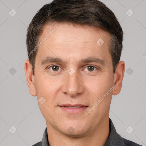 Joyful white adult male with short  brown hair and brown eyes