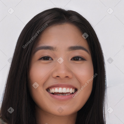 Joyful asian young-adult female with long  brown hair and brown eyes