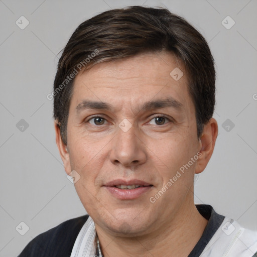 Joyful white adult male with short  brown hair and brown eyes