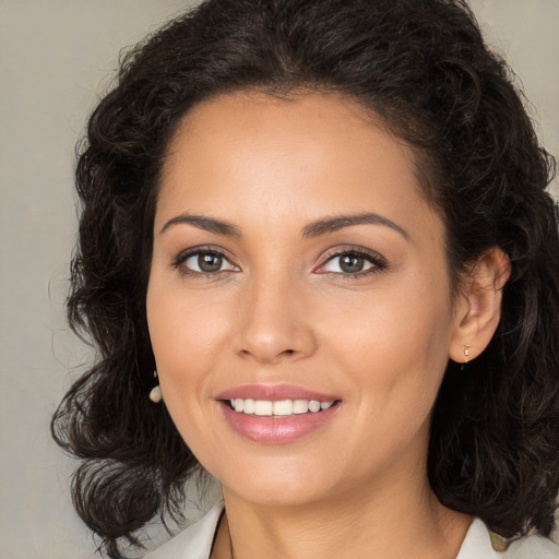 Joyful white young-adult female with medium  brown hair and brown eyes