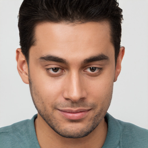 Joyful white young-adult male with short  brown hair and brown eyes