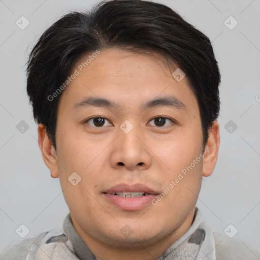 Joyful asian young-adult male with short  brown hair and brown eyes